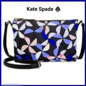 Kate Spade Hawthorne cross-body Carolyn spinner handbag. Navy with pink pinwheel